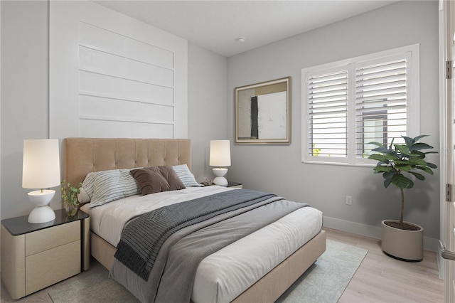 5910 Red Mangrove Ln, Bradenton, FL 34210 - bedroom featuring baseboards and light wood-style flooring