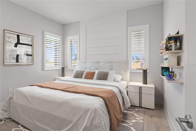 5910 Red Mangrove Ln, Bradenton, FL 34210 - bedroom with wood finished floors and baseboards