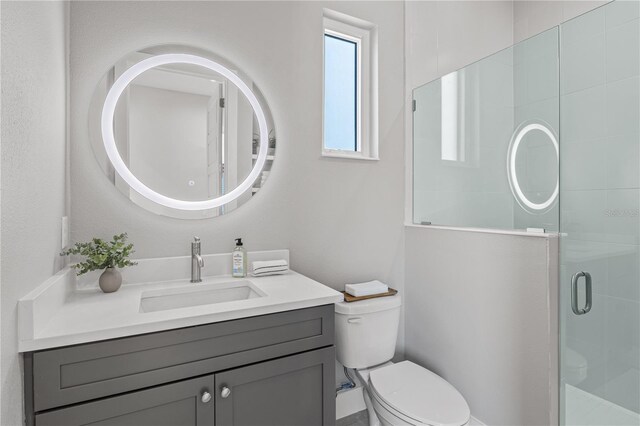 5910 Red Mangrove Ln, Bradenton, FL 34210 - bathroom with a stall shower, toilet, and vanity