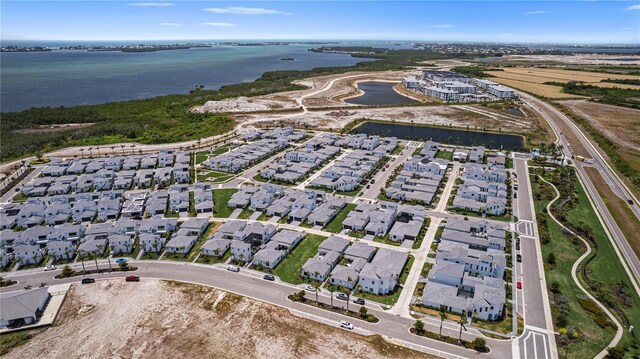 5910 Red Mangrove Ln, Bradenton, FL 34210 - aerial view of property and surrounding area featuring a nearby body of water and nearby suburban area