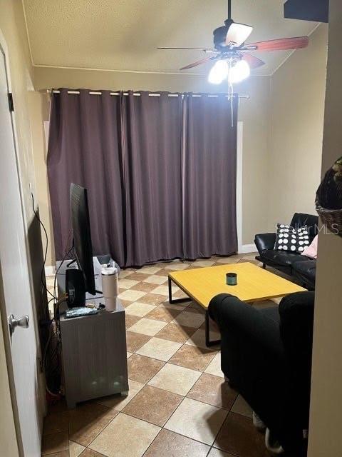 living room featuring a ceiling fan