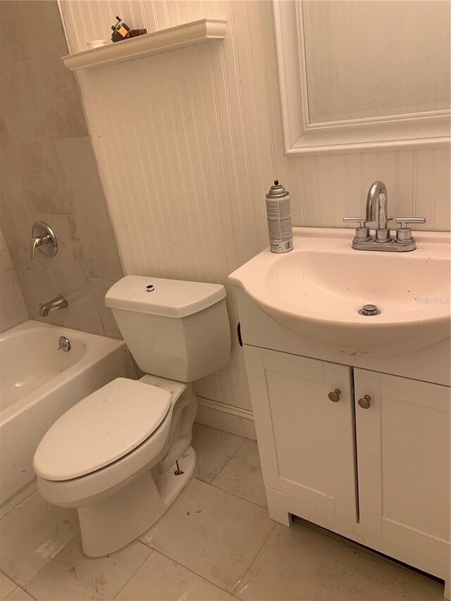 bathroom featuring toilet, vanity, and shower / tub combination