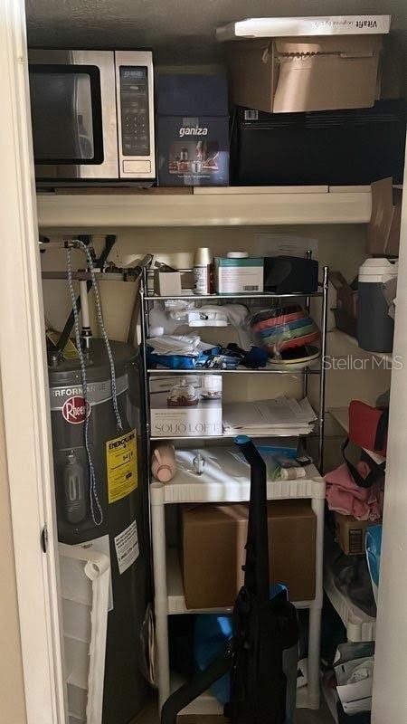 storage area featuring water heater