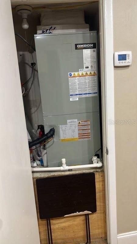 utility room with heating unit
