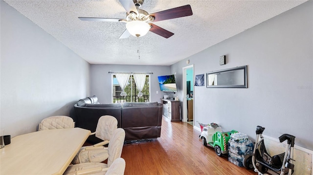 5964 7th Ave W Unit 5964, Bradenton, FL 34209 - office space featuring a textured ceiling, wood finished floors, a ceiling fan, and baseboards