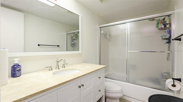 5964 7th Ave W Unit 5964, Bradenton, FL 34209 - bathroom featuring toilet, shower / bath combination with glass door, and vanity