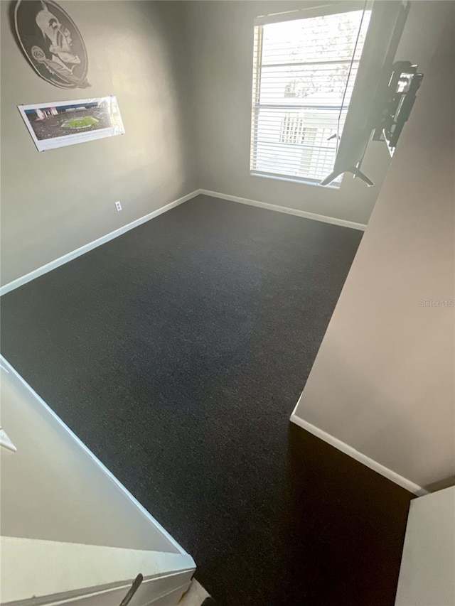 5964 7th Ave W Unit 5964, Bradenton, FL 34209 - spare room featuring baseboards and carpet flooring