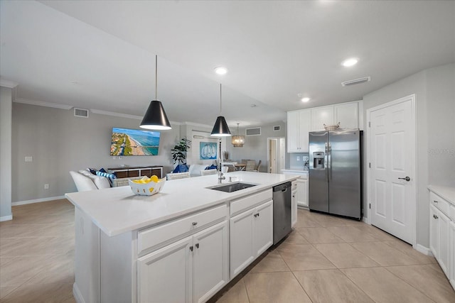 kitchen featuring appliances with stainless steel finishes, a sink, a center island with sink, open floor plan, and white cabinetry