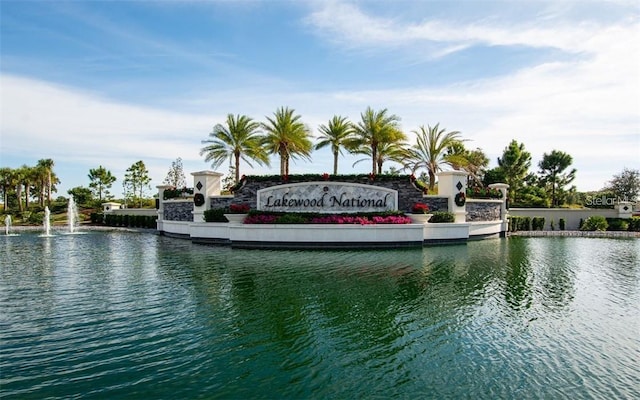 community sign with a water view