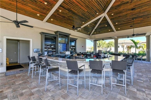 view of patio / terrace featuring a ceiling fan and a gazebo