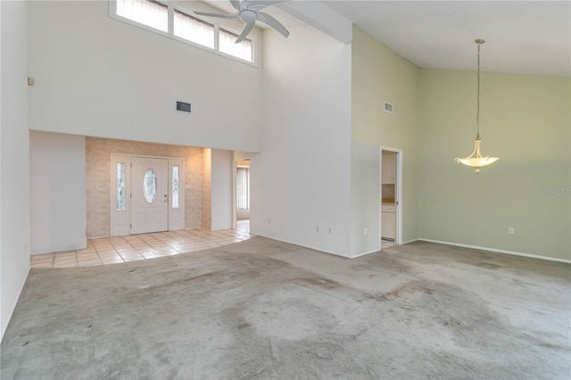 foyer with high vaulted ceiling, carpet, ceiling fan, baseboards, and tile patterned flooring
