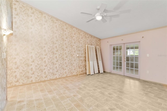 unfurnished room featuring ornamental molding, ceiling fan, french doors, wallpapered walls, and baseboards