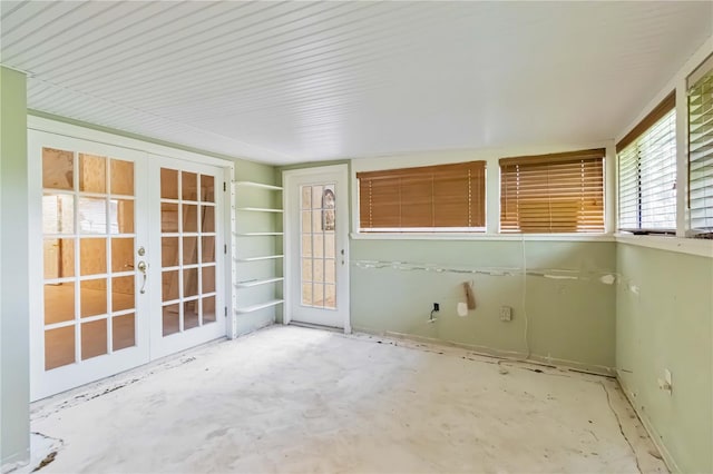 unfurnished sunroom featuring french doors