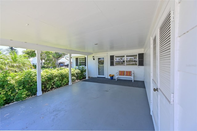 view of patio featuring an attached carport