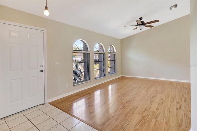 3510 Shawn St, Punta Gorda, FL 33980 - foyer entrance with ceiling fan, light wood-style floors, and baseboards