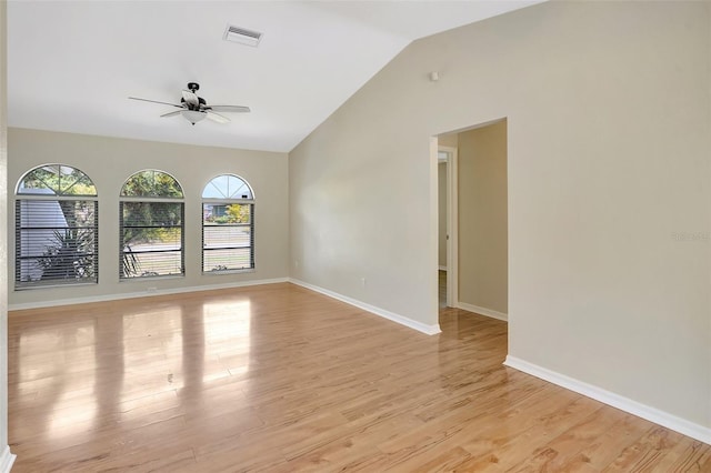 3510 Shawn St, Punta Gorda, FL 33980 - empty room with ceiling fan, healthy amount of natural light, light wood-style floors, vaulted ceiling, and baseboards