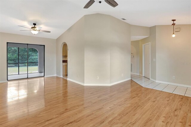 3510 Shawn St, Punta Gorda, FL 33980 - unfurnished room with a ceiling fan, light wood-type flooring, arched walkways, and vaulted ceiling