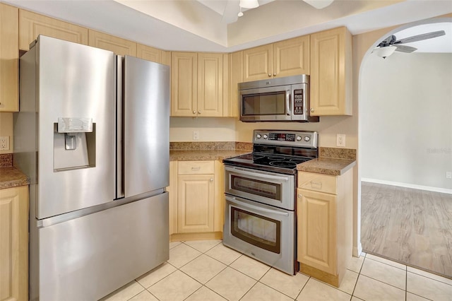 3510 Shawn St, Punta Gorda, FL 33980 - kitchen featuring stainless steel appliances, light brown cabinetry, and a ceiling fan