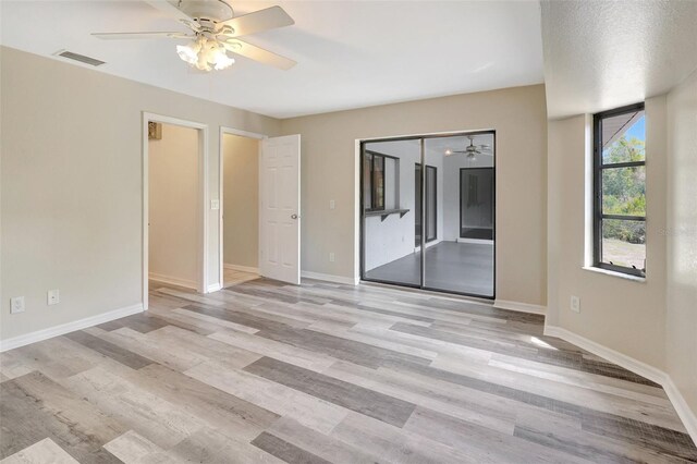 3510 Shawn St, Punta Gorda, FL 33980 - unfurnished bedroom with light wood-style flooring, baseboards, and ceiling fan