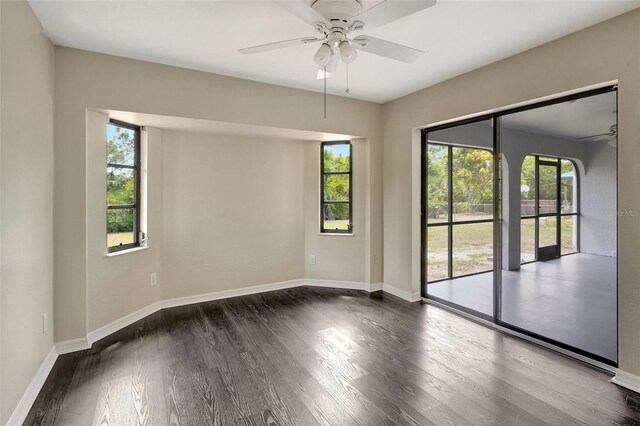 3510 Shawn St, Punta Gorda, FL 33980 - empty room featuring ceiling fan, healthy amount of natural light, dark wood-style floors, and baseboards