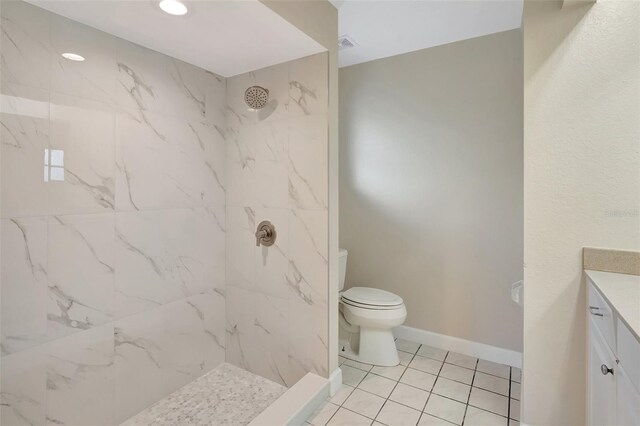 3510 Shawn St, Punta Gorda, FL 33980 - bathroom featuring vanity, toilet, a marble finish shower, tile patterned floors, and baseboards