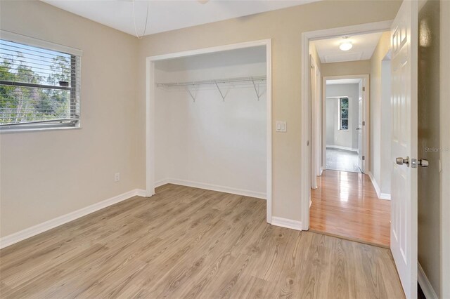 3510 Shawn St, Punta Gorda, FL 33980 - unfurnished bedroom with light wood finished floors, a closet, and baseboards