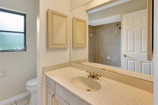 3510 Shawn St, Punta Gorda, FL 33980 - bathroom with vanity, tile patterned floors, toilet, a tile shower, and baseboards