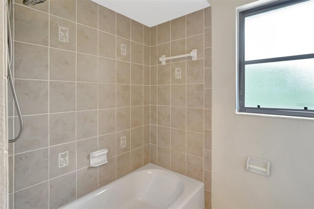 3510 Shawn St, Punta Gorda, FL 33980 - bathroom featuring healthy amount of natural light and bathtub / shower combination