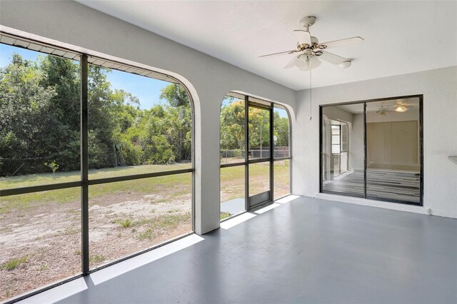 3510 Shawn St, Punta Gorda, FL 33980 - unfurnished sunroom featuring a ceiling fan and concrete floors