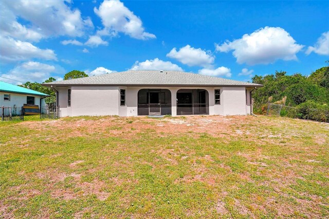 3510 Shawn St, Punta Gorda, FL 33980 - rear view of house featuring a sunroom and stucco siding