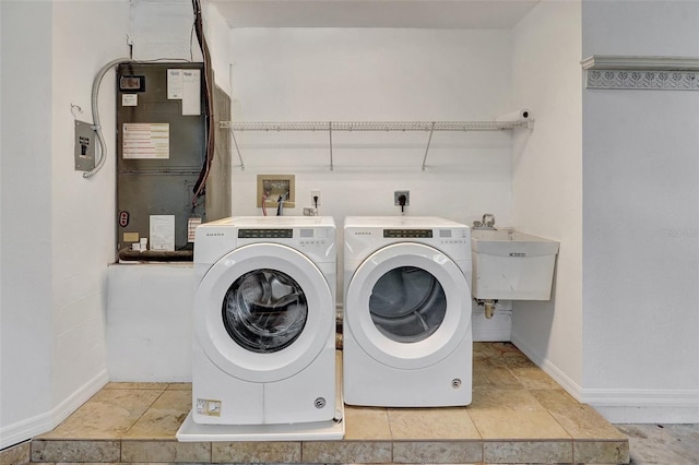 3510 Shawn St, Punta Gorda, FL 33980 - washroom with heating unit, baseboards, and independent washer and dryer