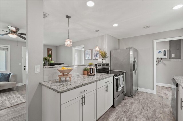 3102 16th Ave W, Bradenton, FL 34205 - kitchen featuring stainless steel appliances, light wood-style flooring, ceiling fan, white cabinetry, and electric panel