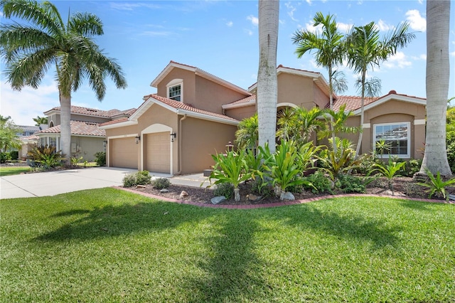 7626 Double Pine Dr, Sarasota, FL 34240 - mediterranean / spanish-style house featuring stucco siding, a garage, concrete driveway, a front lawn, and a tile roof