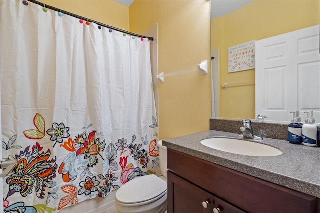 7626 Double Pine Dr, Sarasota, FL 34240 - full bathroom featuring vanity, toilet, and curtained shower