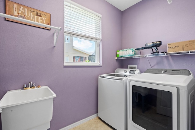 7626 Double Pine Dr, Sarasota, FL 34240 - laundry area with washing machine and dryer and baseboards