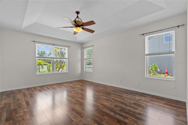 7626 Double Pine Dr, Sarasota, FL 34240 - empty room with a raised ceiling, wood finished floors, baseboards, and a ceiling fan
