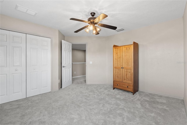 7626 Double Pine Dr, Sarasota, FL 34240 - unfurnished bedroom with carpet flooring, a closet, baseboards, and a ceiling fan