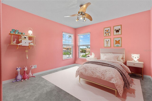 7626 Double Pine Dr, Sarasota, FL 34240 - carpeted bedroom with baseboards and ceiling fan