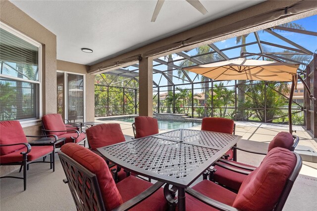 7626 Double Pine Dr, Sarasota, FL 34240 - view of patio with ceiling fan, an outdoor pool, glass enclosure, and outdoor dining area