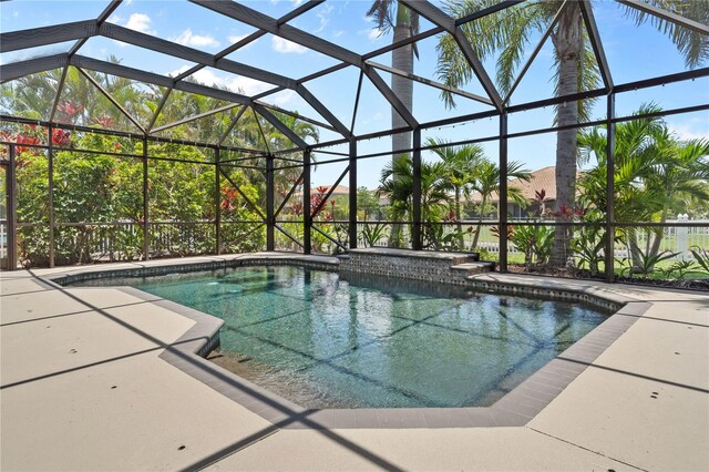 7626 Double Pine Dr, Sarasota, FL 34240 - outdoor pool featuring a lanai and a patio