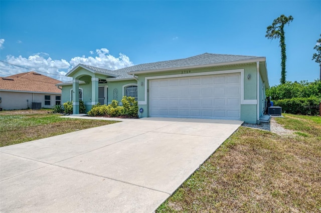 2759 Starview Ave, North Port, FL 34288 - single story home featuring stucco siding, central AC unit, concrete driveway, and an attached garage