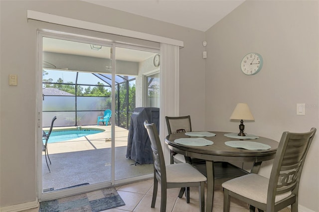 2759 Starview Ave, North Port, FL 34288 - tiled dining room featuring a sunroom and lofted ceiling