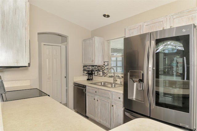 2759 Starview Ave, North Port, FL 34288 - kitchen featuring stainless steel refrigerator with ice dispenser, a sink, dishwasher, light countertops, and stove