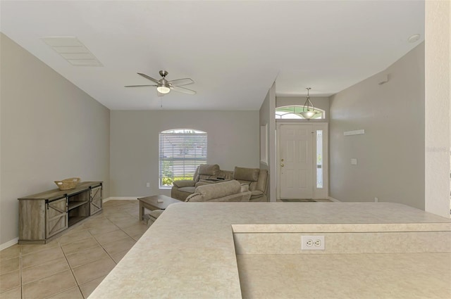 2759 Starview Ave, North Port, FL 34288 - entryway featuring light tile patterned floors, healthy amount of natural light, and baseboards