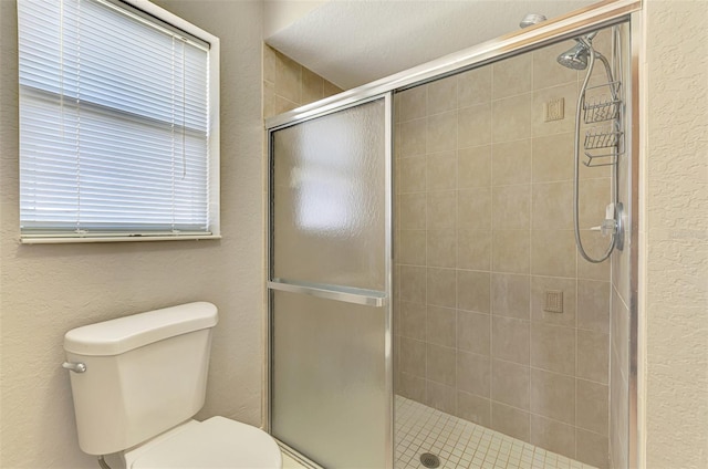 2759 Starview Ave, North Port, FL 34288 - bathroom featuring a stall shower, toilet, and a textured wall