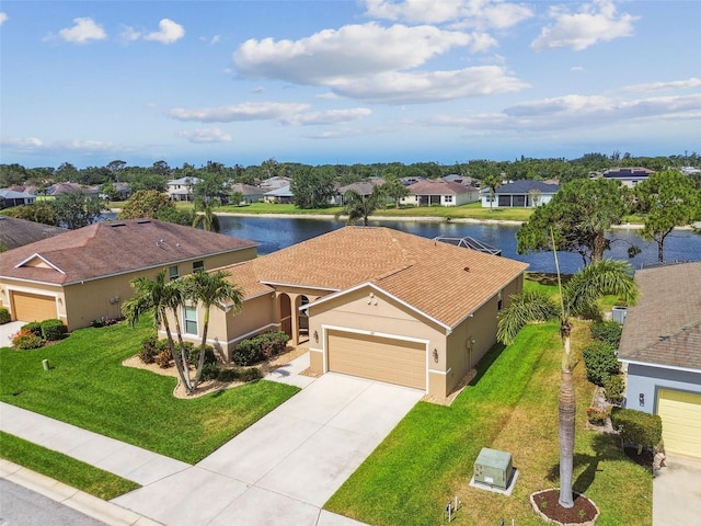 aerial perspective of suburban area with a large body of water
