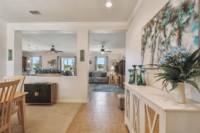 living room featuring a ceiling fan, ornamental molding, baseboards, recessed lighting, and light carpet