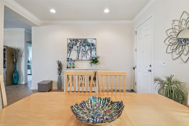 dining room with ornamental molding, recessed lighting, and baseboards