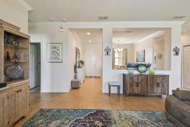 tiled living room featuring crown molding, baseboards, recessed lighting, and a chandelier