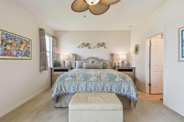 bedroom with light carpet, baseboards, and ceiling fan